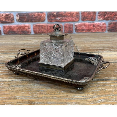 182 - A rather good Art Nouveau inkwell, on a tortoiseshell and silver stand with a silver topped glass we... 