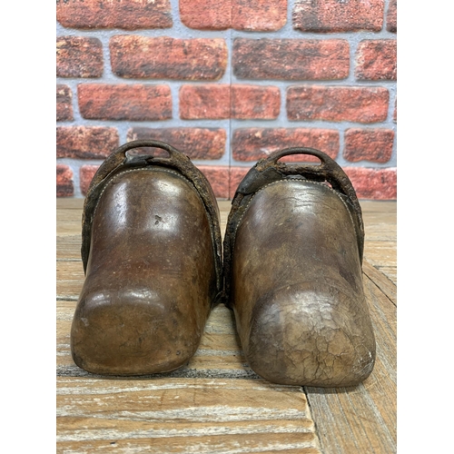 343 - Pair of antique 17th century brown leather hand forged Spanish horse stirrups, reinforced at the fro... 