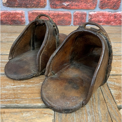 343 - Pair of antique 17th century brown leather hand forged Spanish horse stirrups, reinforced at the fro... 