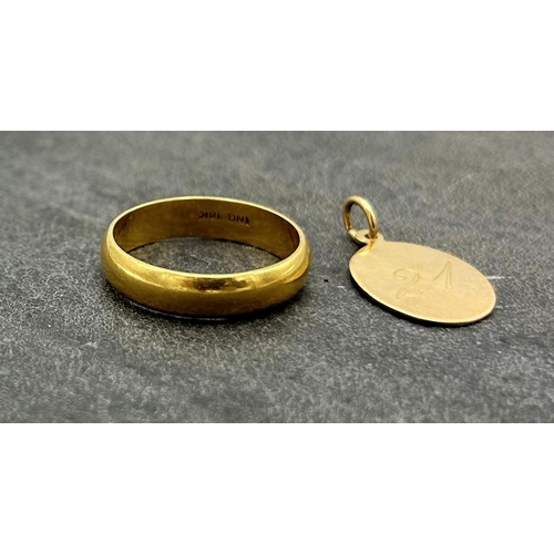 69 - 18k gold wedding band, size S, 5.3g, with a further 10k inscribed dog collar type pendant, 1.1g (2)