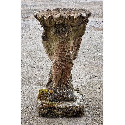 1023 - Weathered reconstituted stone cherub bird bath, H 64cm