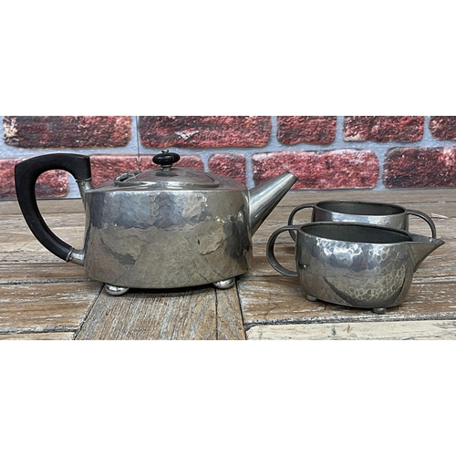 2234 - Archibold Knox for Liberty and Co of London Tudric pewter three piece tea service with hammered fini... 