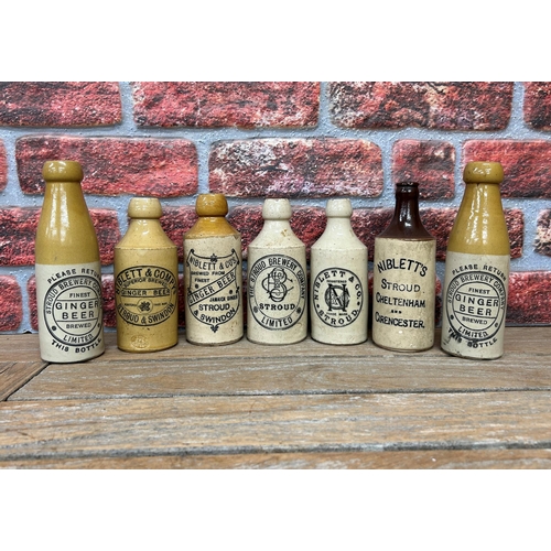 2495 - Collection of Stroud related stoneware ginger beer bottles, assortment of 'Niblett' and 'Stroud Brew... 