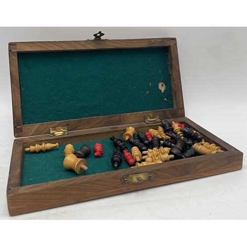 241 - Antique walnut cased travel chess set with turned pieces, 17cm long