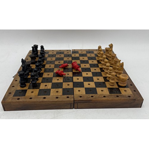 241 - Antique walnut cased travel chess set with turned pieces, 17cm long