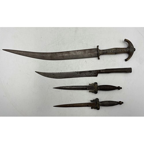 2465 - Four unusual daggers to include a horn handled middle eastern example, 46cm long, pair of woven hand... 