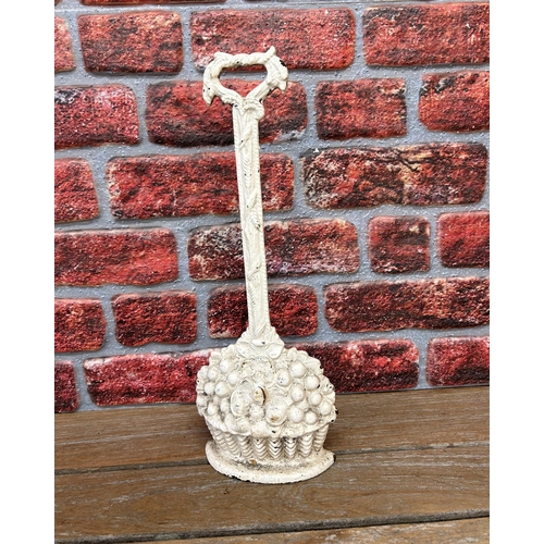 2265 - White cast iron doorstop in the form of fruit in a basket, H 45cm