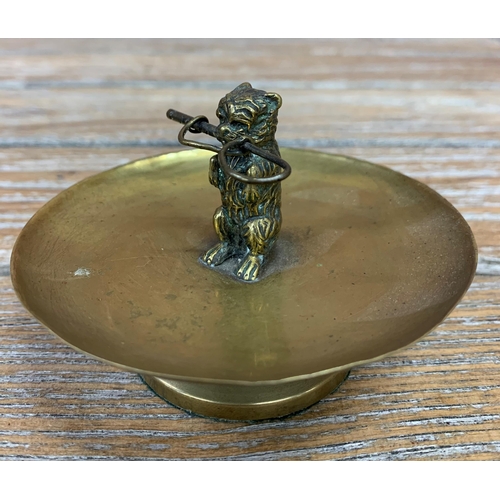 298 - Victorian brass vide poche trinket bowl with terrier finial holding whip, H 7cm x D 10cm