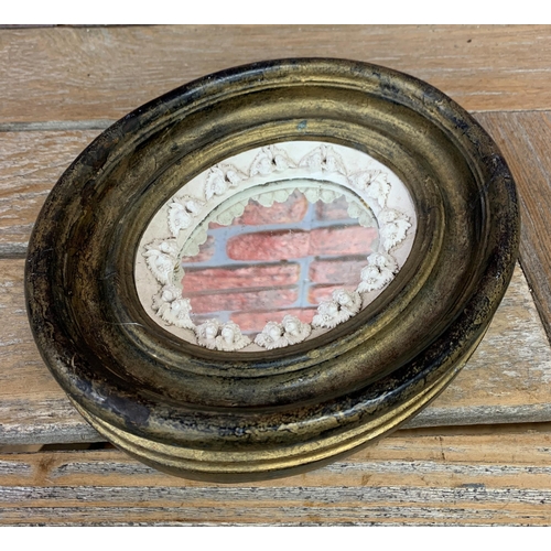 2438 - 19th century gilt vanity mirror with plaster relief of cherubs with original mercury glass, H 23cm x... 