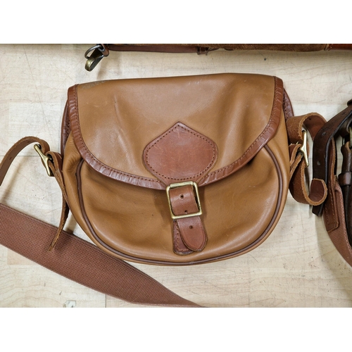 314 - Two brown leather shotgun cartridge bags with further leather shotgun slip (3)