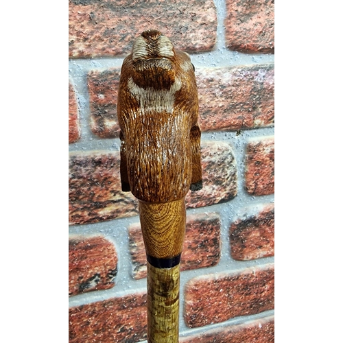 301 - Hand carved hares head walking stick, L 130cm