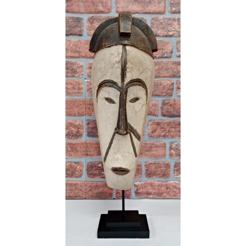 2120 - Vintage Fang Hand Carved Wooden Mask The Ngil (ni-jil) mask originated from a hunting group known as... 