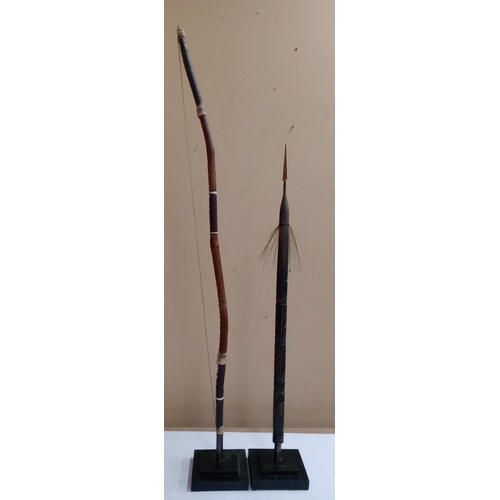 2136 - Vintage Leather wrapped Bow, H119 and top of an African Spear, H90cm, both displayed on heavy black ... 