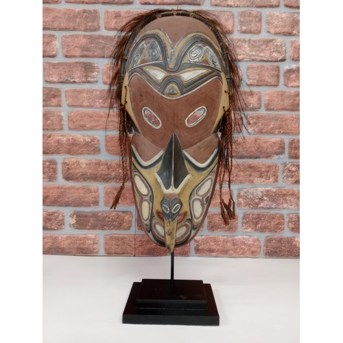 2137 - Large Sepik River Tribe Carved Wood Mask from Papua New Guinea, displayed on heavy black Metal stand... 