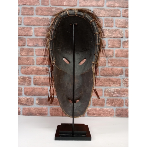 2137 - Large Sepik River Tribe Carved Wood Mask from Papua New Guinea, displayed on heavy black Metal stand... 