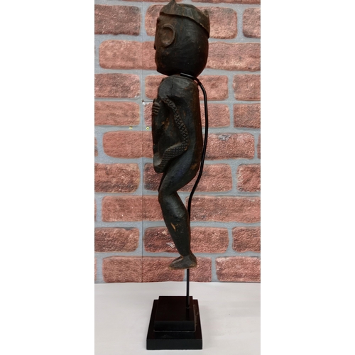 2138 - Vintage African Dan style hand carved wooden statue figure, displayed on heavy black Metal stand, H6... 