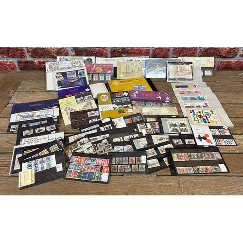 2554 - Album of Channel Island presentation stamp packs with a large collection of further GB and world pre... 