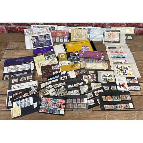 2554 - Album of Channel Island presentation stamp packs with a large collection of further GB and world pre... 