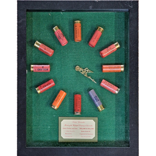 381 - Novelty sporting wall clock, the markers being shot cartridges by Holland & Holland, James Purdey & ... 