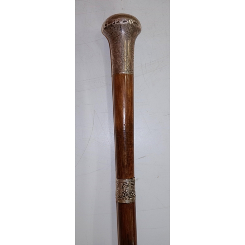 398 - A good quality Malacca cane sword stick, swagger stick, with Silver top, marked TD (Thomas Davis) Lo... 