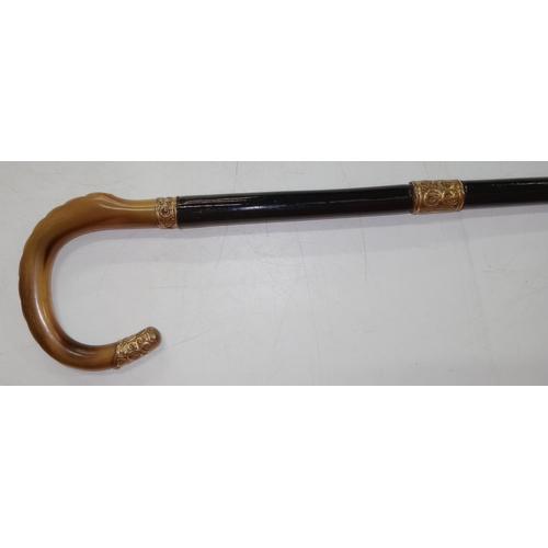 400 - A good quality ebony antique walking stick sword stick with a crook bone handle, mounted in silver g... 