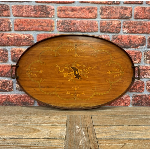 2199 - Large oval twin handled gallery tray with scrolled inlay finish and central torch and arrow motif, L... 