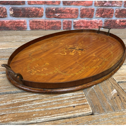 2199 - Large oval twin handled gallery tray with scrolled inlay finish and central torch and arrow motif, L... 