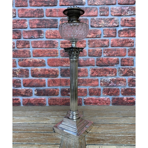 2394 - Table lamp formed from a Victorian Silver plated oil lamp of Corinthian column form, on a squared st... 