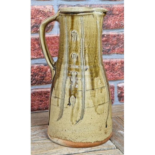 2072 - Jim Malone (born 1946) - a stoneware jug with incised decoration, impressed JM and A (for Ainstable)... 