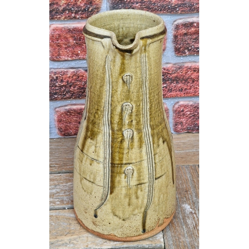 2072 - Jim Malone (born 1946) - a stoneware jug with incised decoration, impressed JM and A (for Ainstable)... 