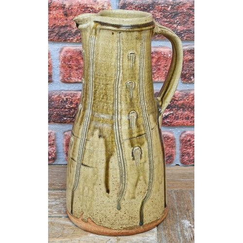 2072 - Jim Malone (born 1946) - a stoneware jug with incised decoration, impressed JM and A (for Ainstable)... 