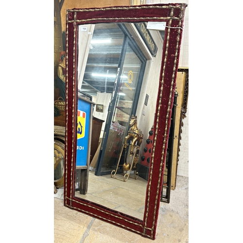 2443 - 19th century French velvet framed mirror with applied copper bands, 127 x 66cm