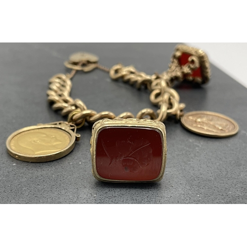 71 - 9ct charm bracelet with heart padlock clasp, St Christopher, 1904 sovereign, two carnelian seals one... 