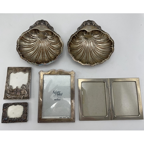 201 - Mixed collection of silver plate comprising a gallery tray, two scallop shell dishes, four picture f... 