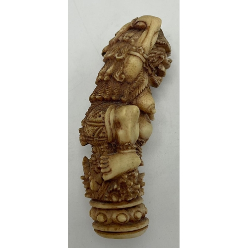 2155 - Hand carved Indonesian mythical beast bone dagger handle, H 10cm