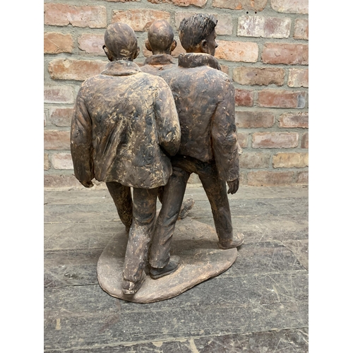 634 - Deborah McCabe (20th/21st century) - Three walking figures, terracotta sculpture, 60cm high