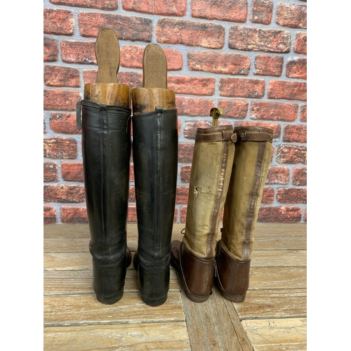 386 - Two pairs of riding boots with wooden and plastic shoe lasts, to include early black leather example... 