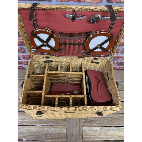 2334 - Impressive wicker picnic hamper with leather handle and buckle finish, fitted interior to include pl... 