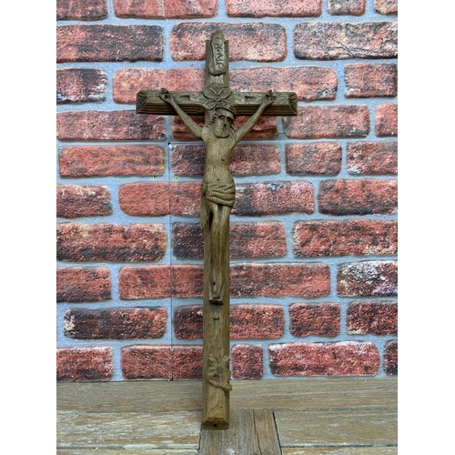 2198 - Hand carved wooden Folk Art crucifix, L 67cm