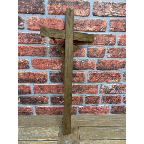 2198 - Hand carved wooden Folk Art crucifix, L 67cm