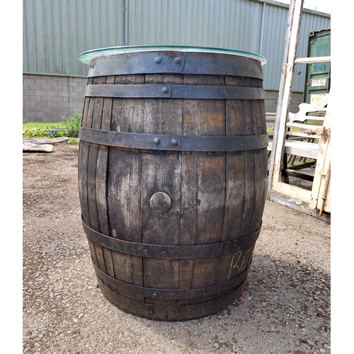 1003 - Vintage wrought iron bound coopered oak barrel with glass top, H 87cm x W 65cm approx