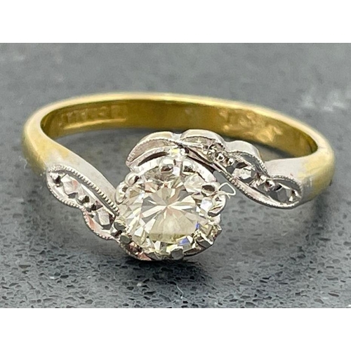57 - 18ct diamond crossover ring, centrally set with .5ct stone, size K/L, 3g