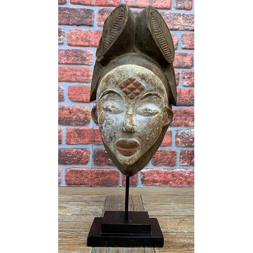 2122 - Vintage Punu Hand Carved Wooden Mask, its white face with nine dots on the forehead symbolizing the ... 