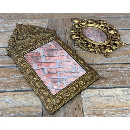 2415 - Antique repousse gilt cushioned mirror having original bevelled glass with floral and scalloped surr... 