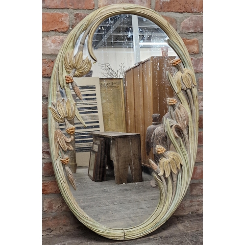 2441 - 1970s oval wall mirror carved with polychrome flowers, possibly by Maison Jansen, 104 x 67cm