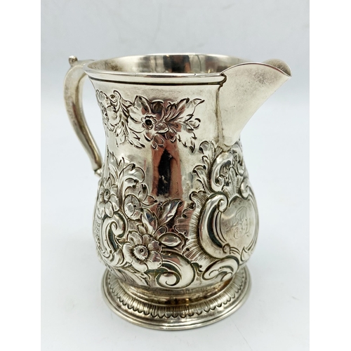 94 - George II silver baluster jug, later chased with flowers, maker Thomas Whipham, London 1752, 10.5cm ... 
