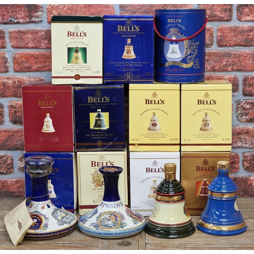 2329 - Large collection of boxed whisky to include Bells and British Navy Pussers Rum in Wade pottery decan... 