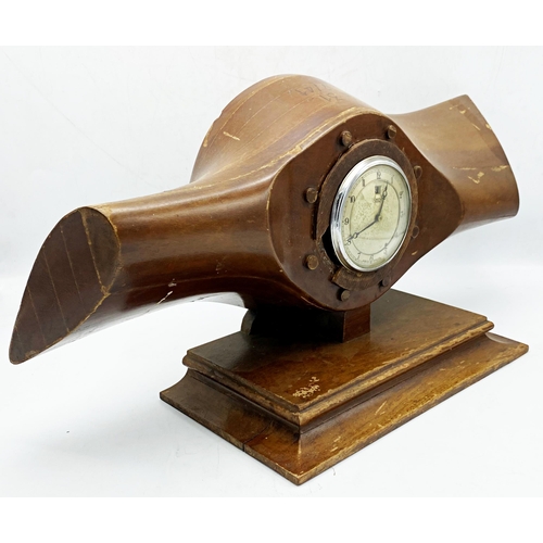 261 - Vintage propeller teak mantle clock, inscribed 'R. 316 7/41', fitted with a Smiths Electric clock, H... 