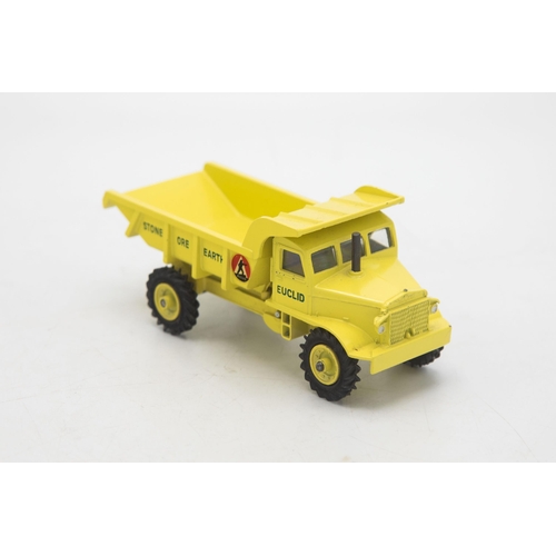 3104 - Dinky Toys 965 Euclid Rear Dump Truck, late picture box showing a forest clearing construction site,... 