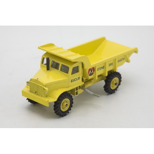 3104 - Dinky Toys 965 Euclid Rear Dump Truck, late picture box showing a forest clearing construction site,... 